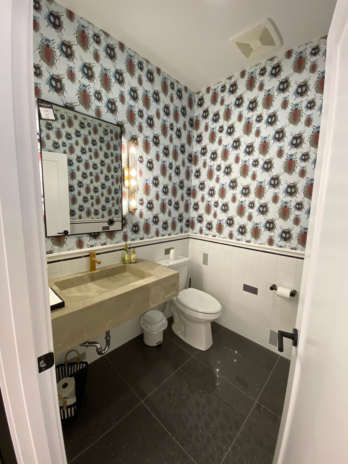 Cute beetle and bug wallpaper installed in a bathroom/powder room. Removable, peel and stick, waterproof, durable, commercial grade and washable. Locally created and printed in Canada.